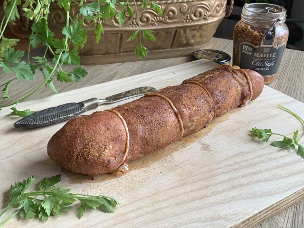 Letting the pork tenderloin rest before cutting.
