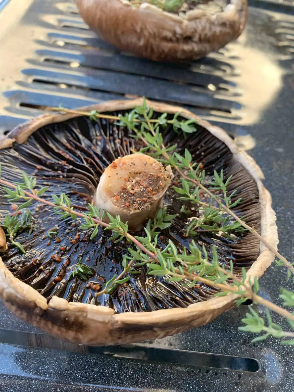 Mushrooms on a broiling pan.