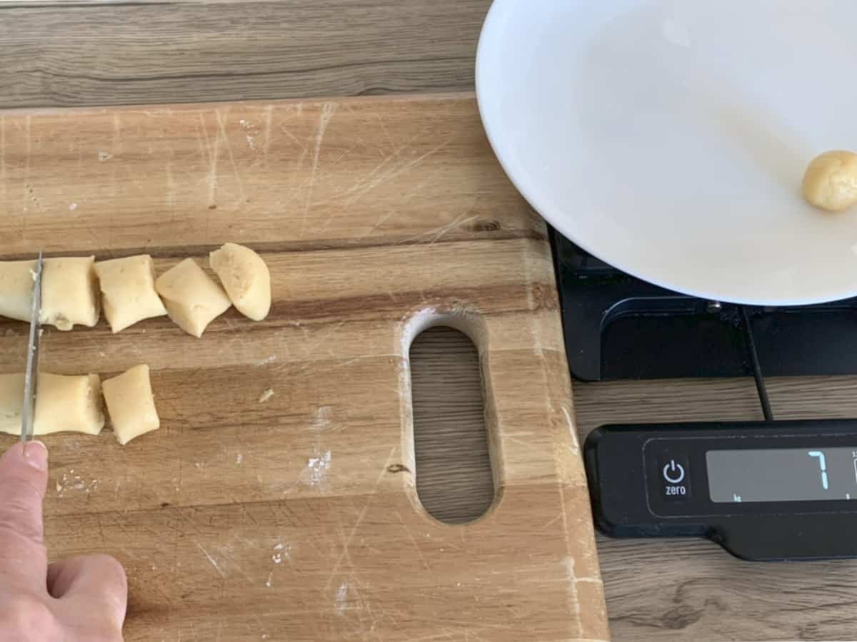 Portioning the 7 gram dough pieces.
