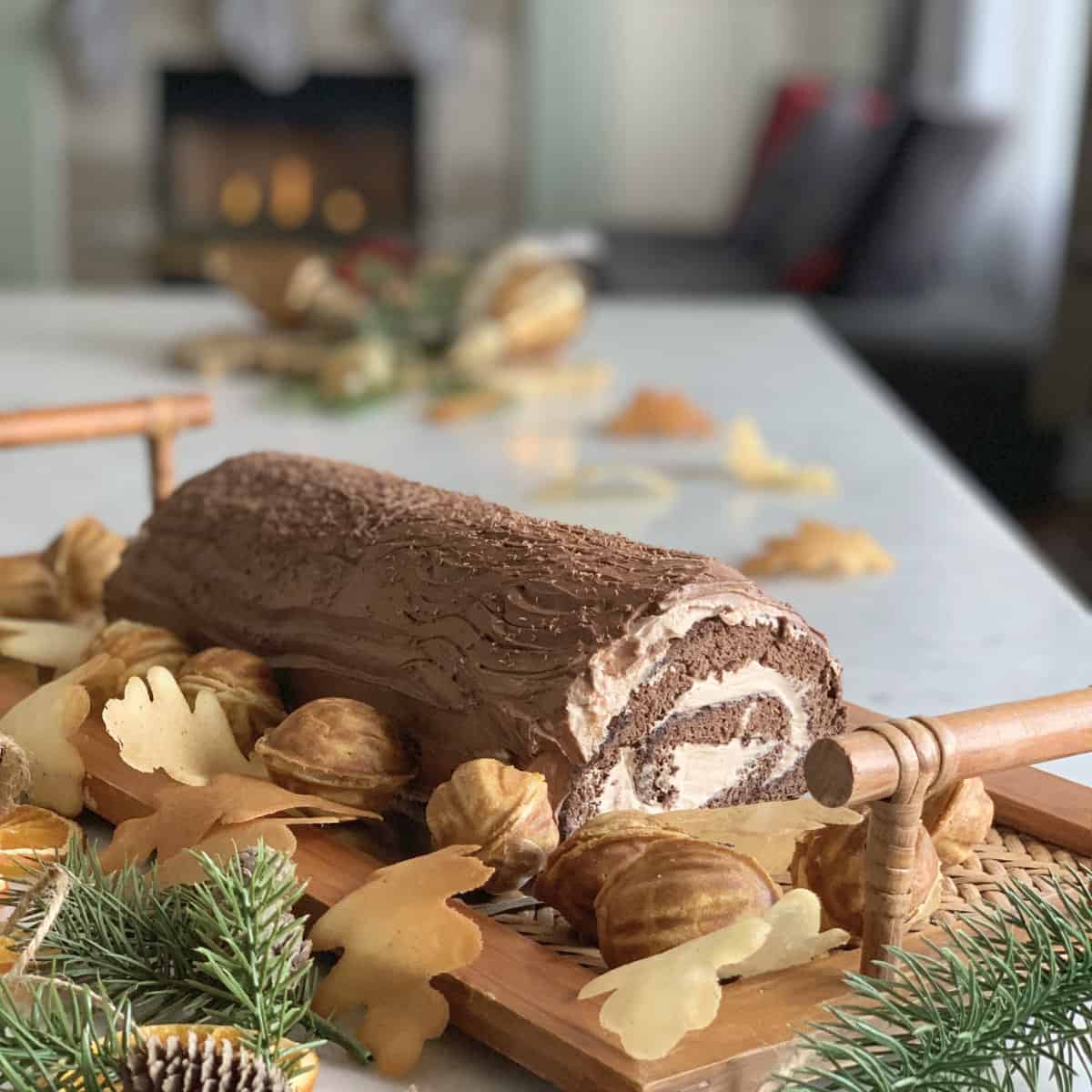 Buche De Noel Tiramisu-Cake in front of the fireplace.
