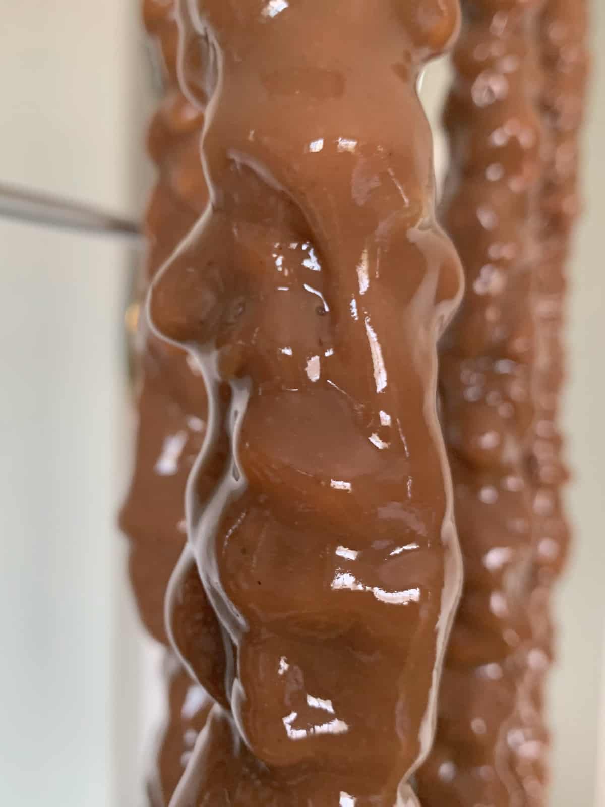 Freshly dipped sweet sujukh is hanging.