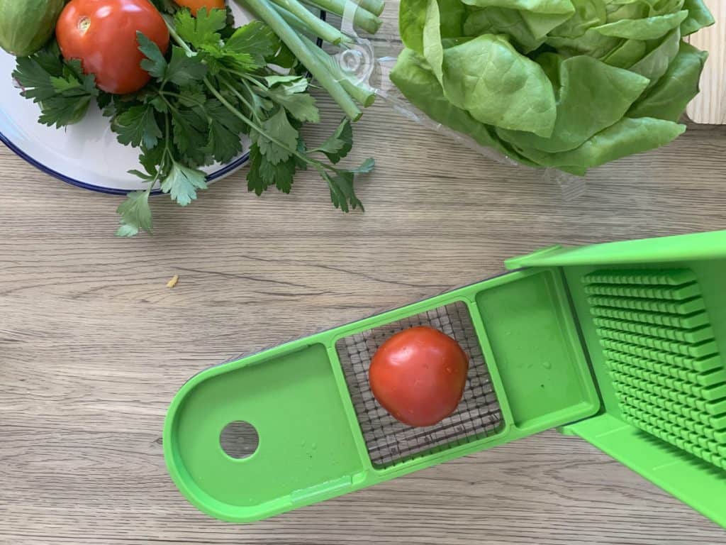 Chopping tomatoes for garnish.