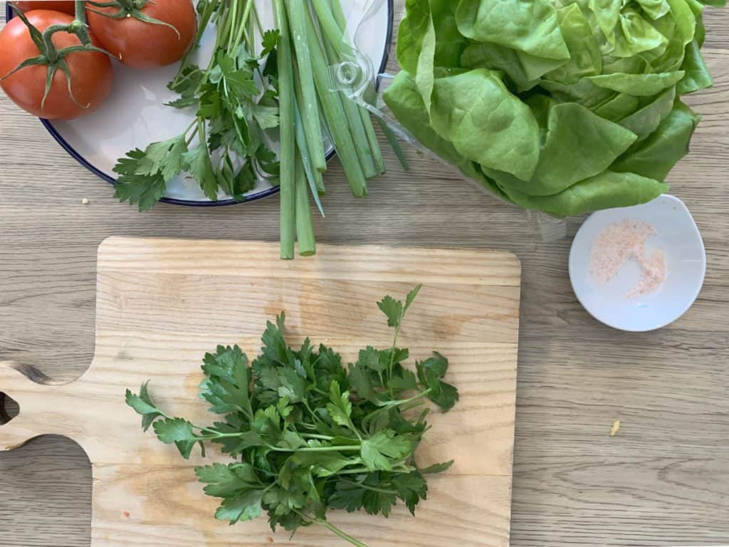 Chopping scallions for garnish.