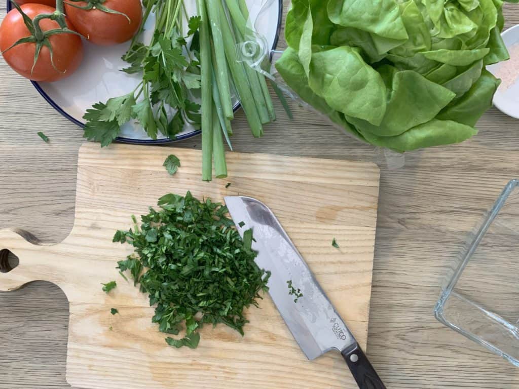 Chopping parsley for garnish.
