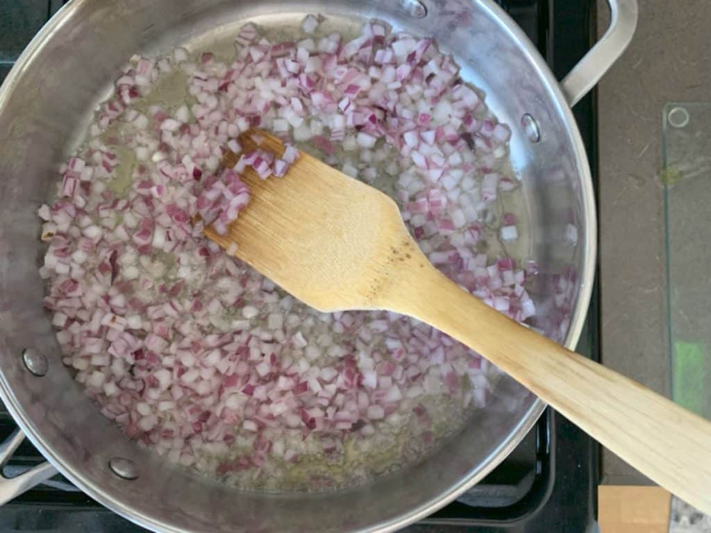 Frying diced onion.