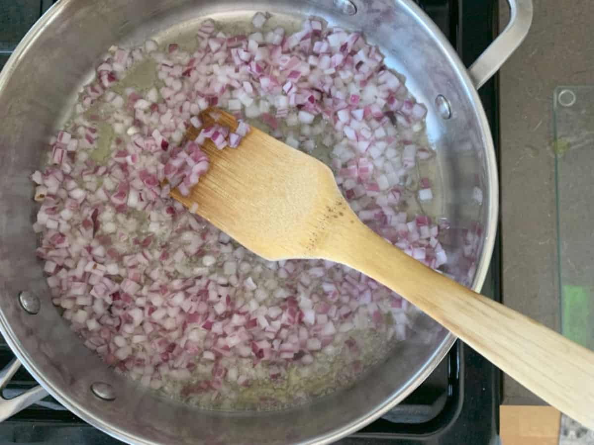 Frying diced onion.