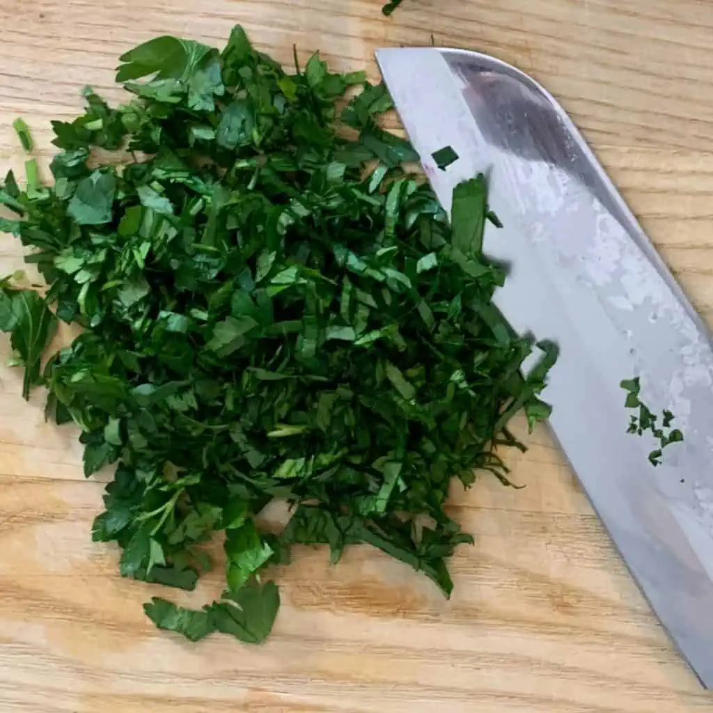 Chopping parsley.