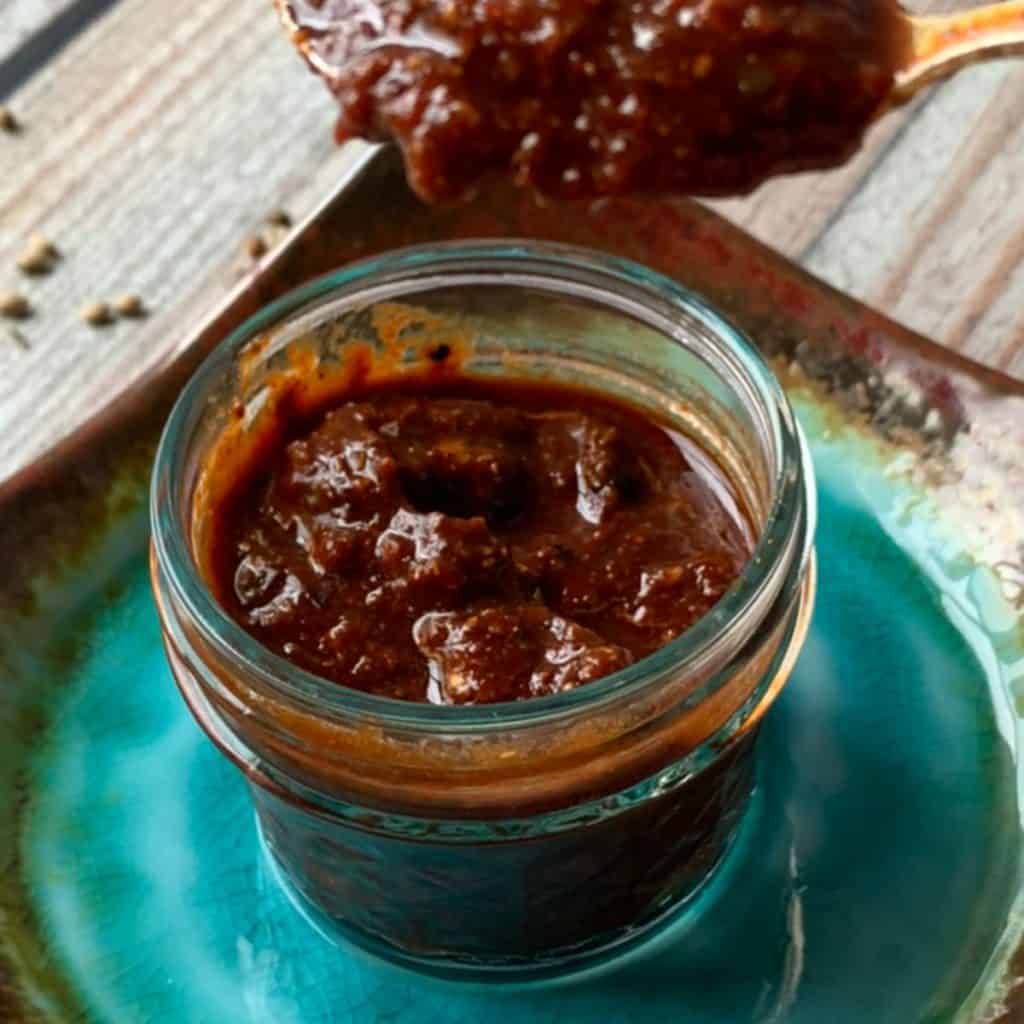 Homemade Fiery Harissa Paste in a jar.