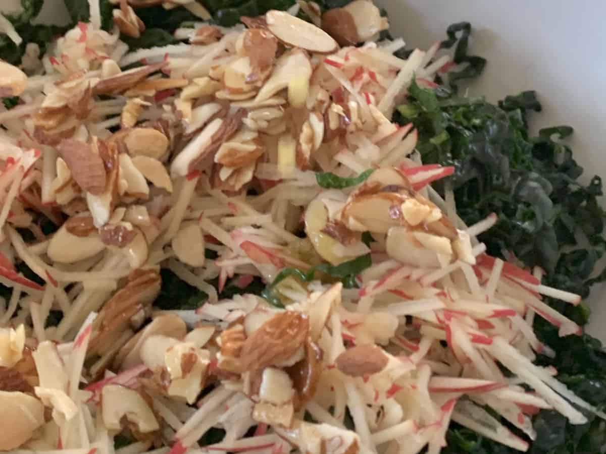 Close up shot of the kale salad with almond praline.