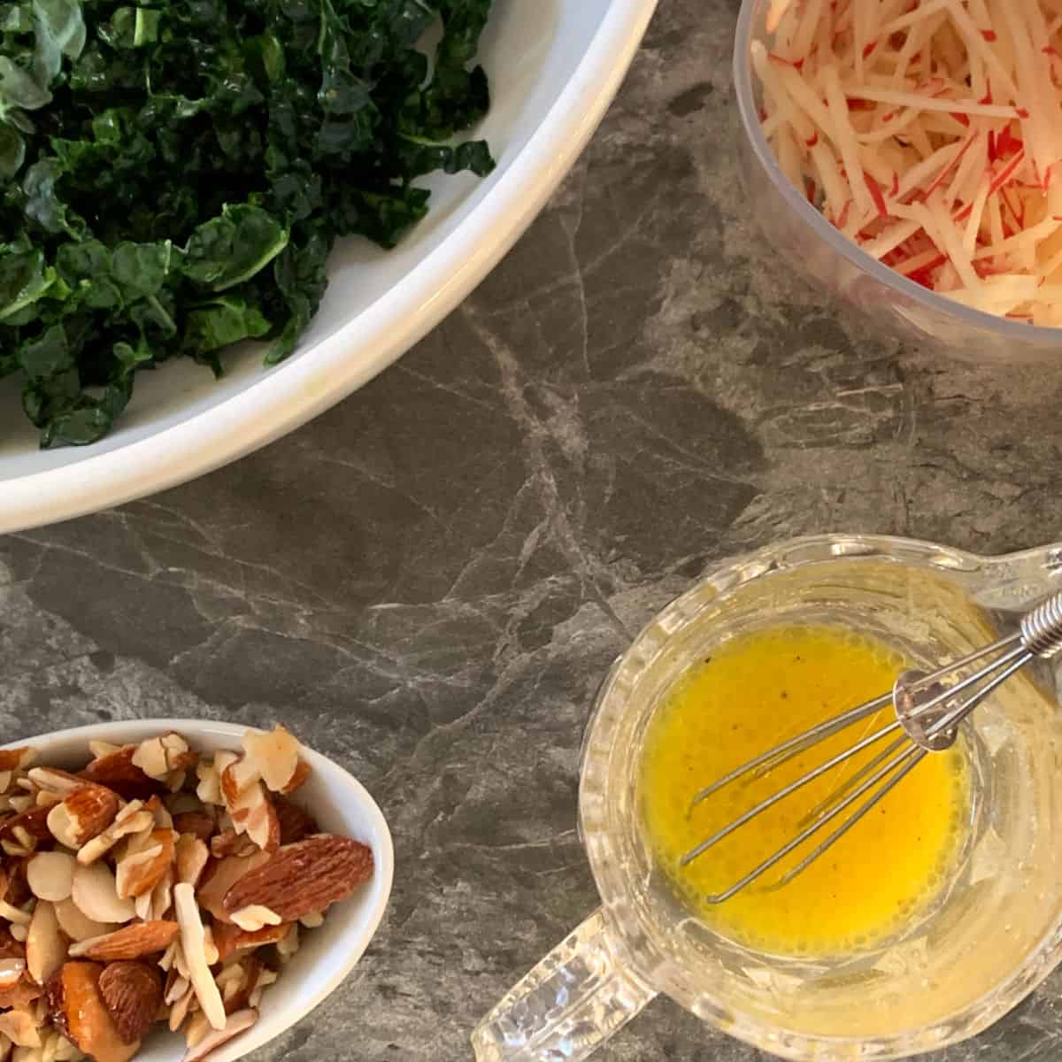 All the salad components are ready to make the kale and apple salad.
