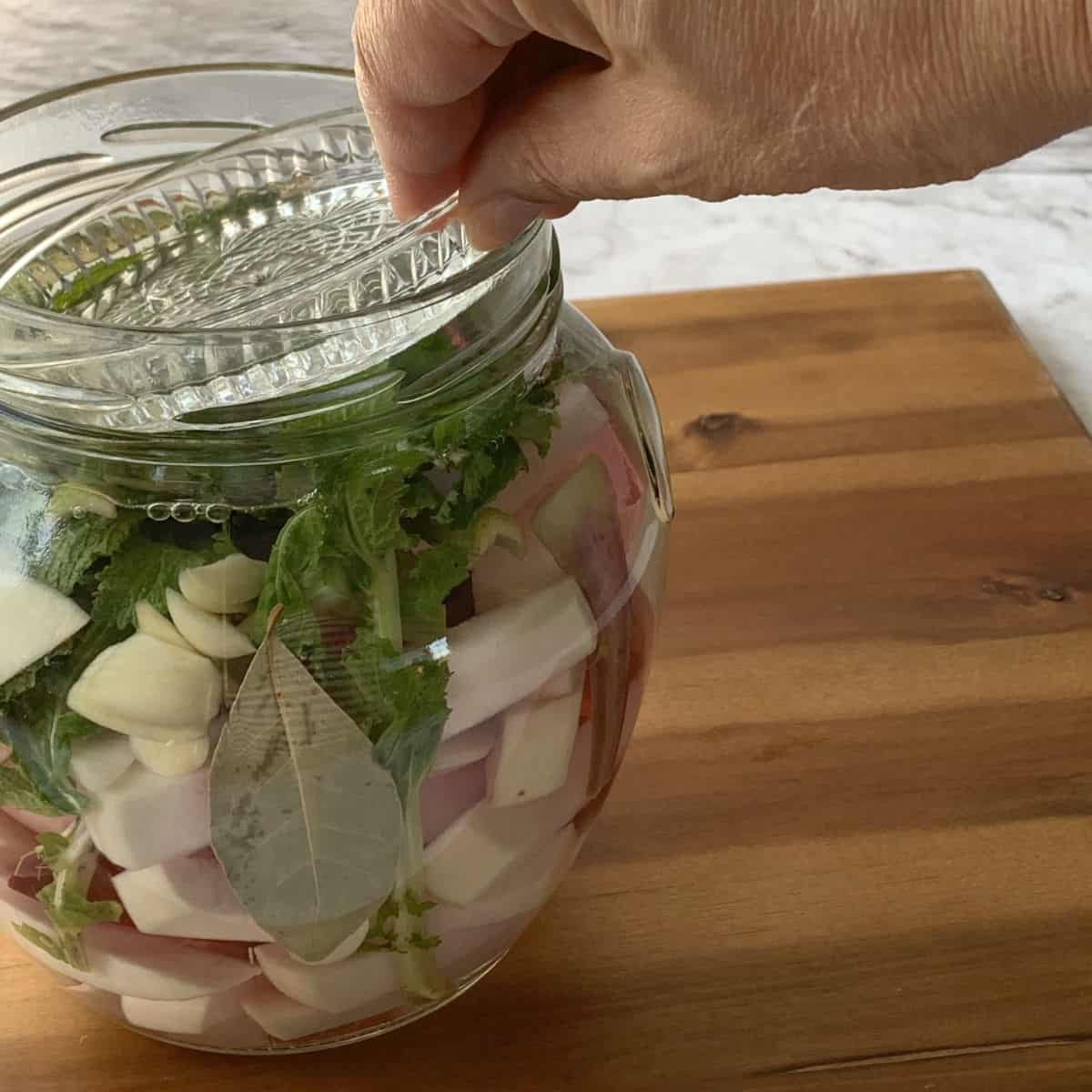 Placing glass weight on a turnips.