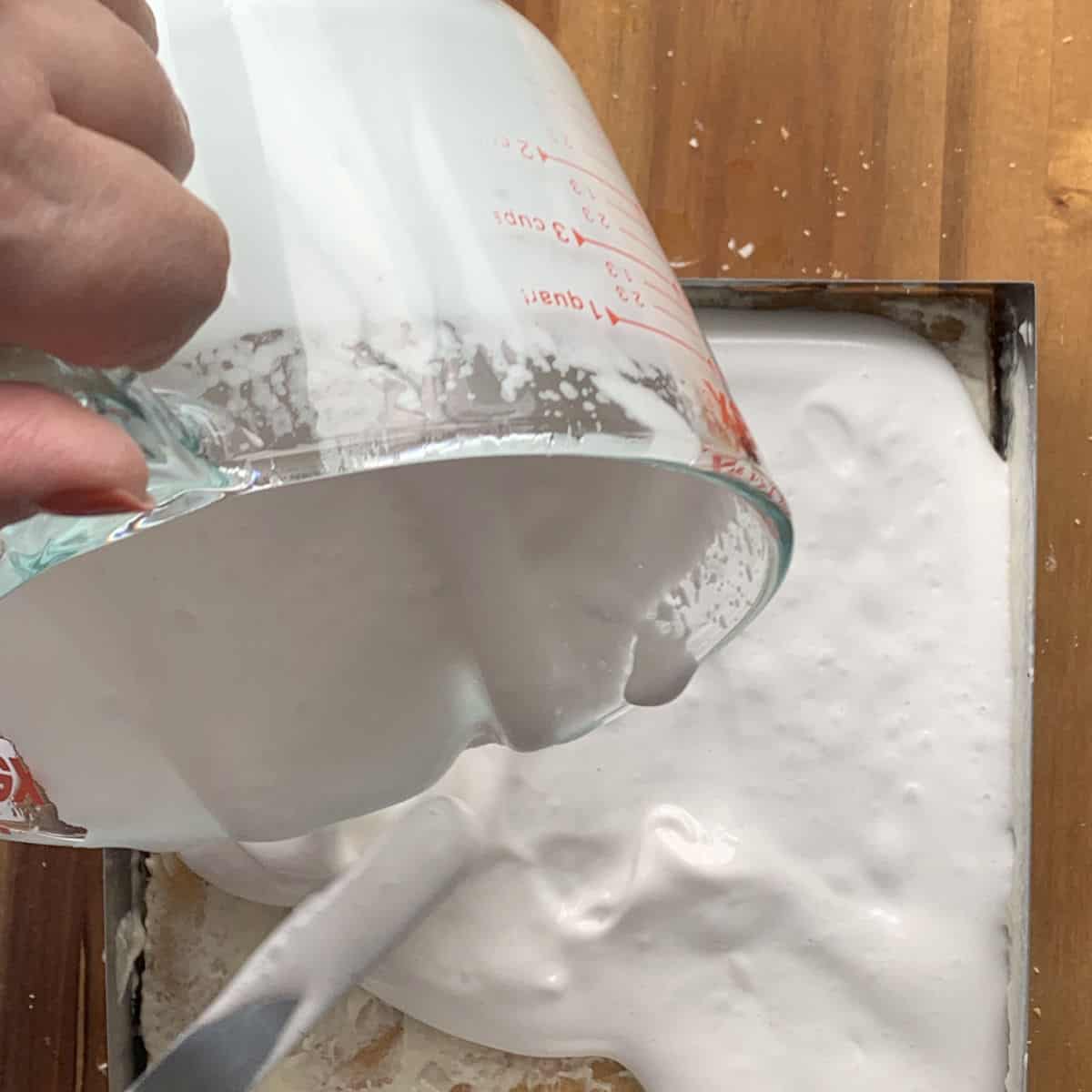 Assembling the cake by adding the soufflé.