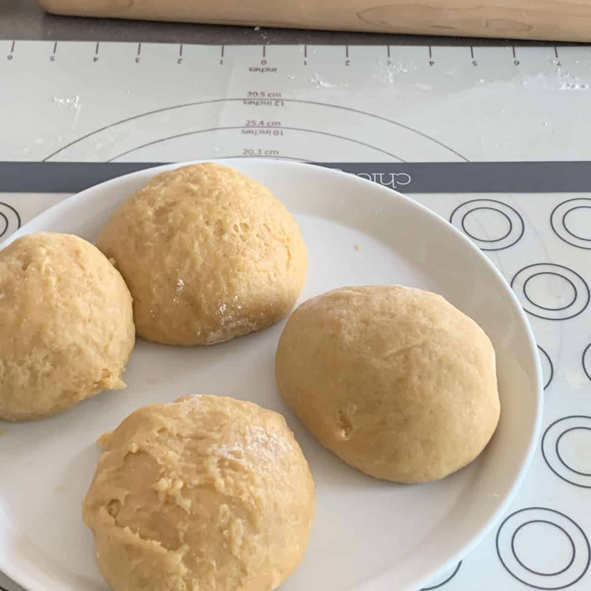 Birds milk dough divided into four balls.