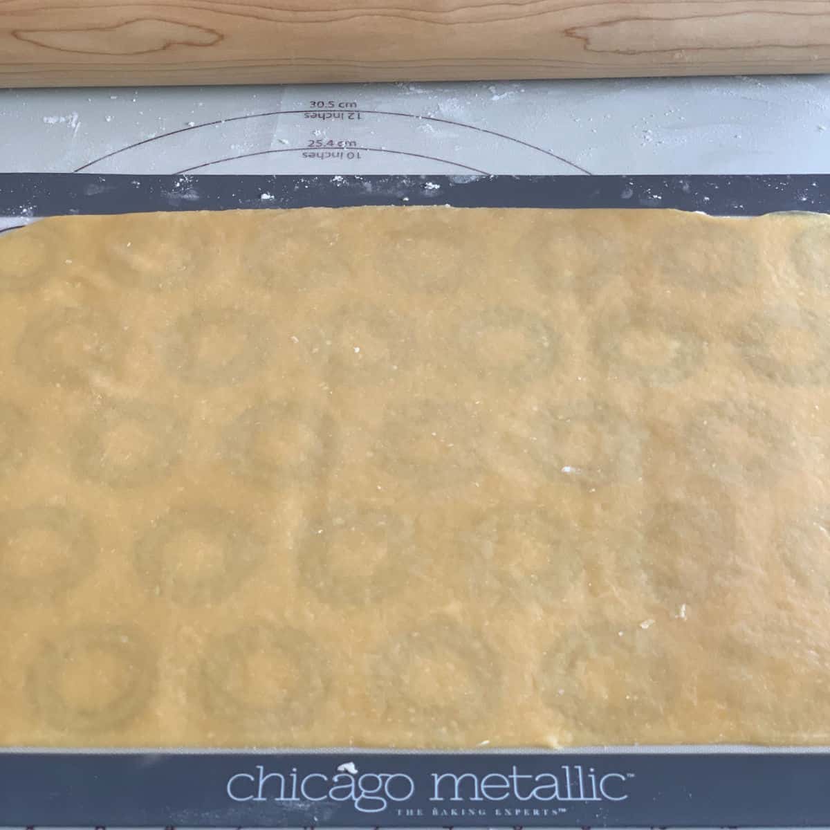 The dough is rolled into a rectangular sheet.