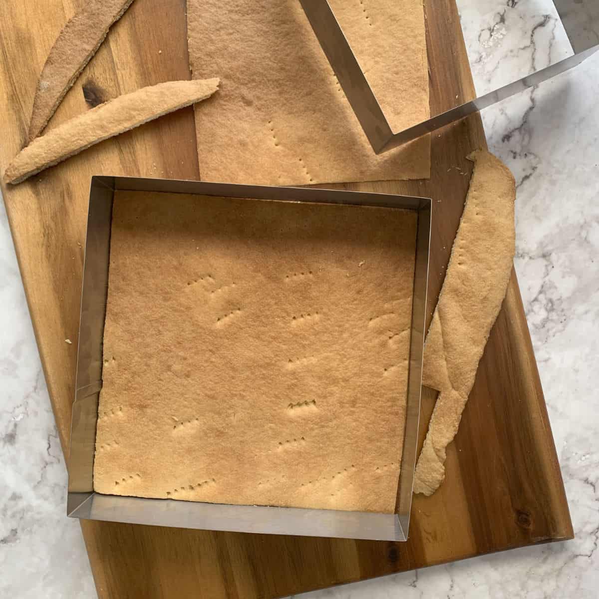Cutting the baked sheet cake to desired size.
