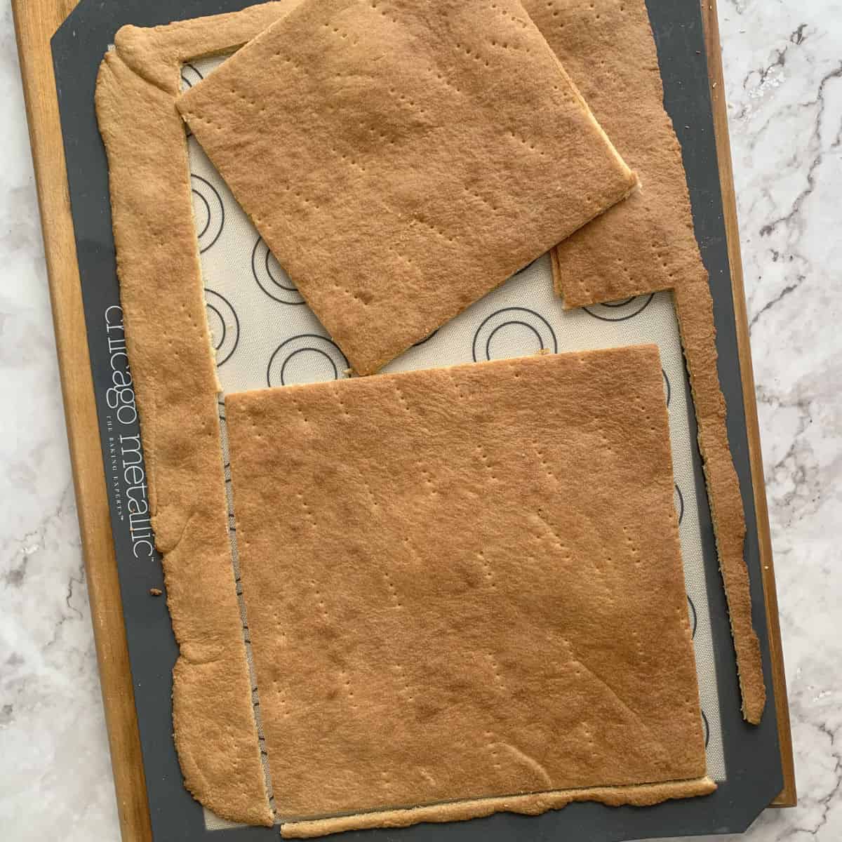 Cutting the baked sheet cake to desired size.