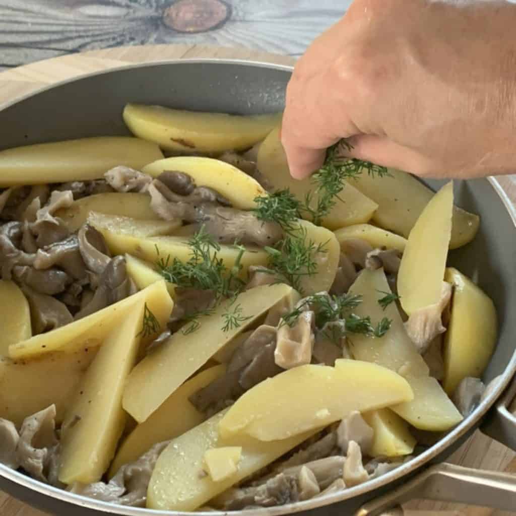 Adding cream to oyster Mushroom and Potatoes.