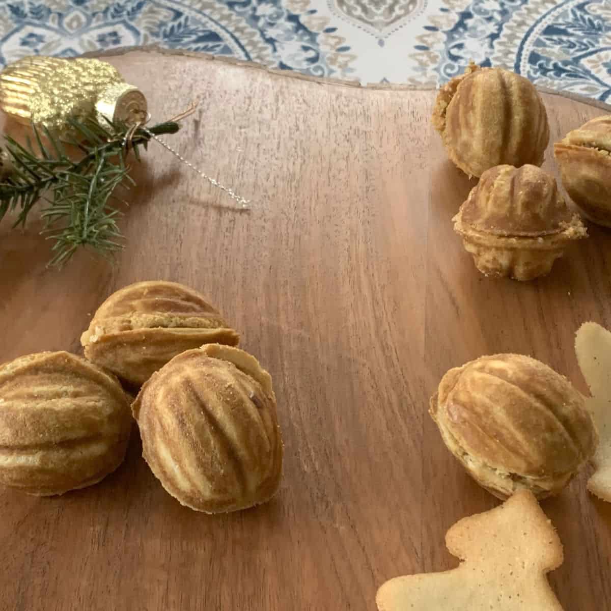 Walnut cookies on a board.