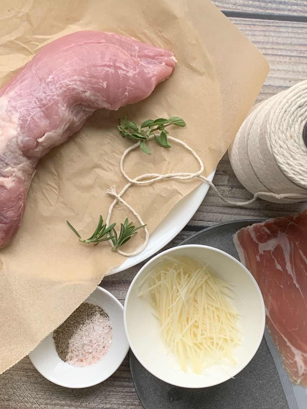 Pork tenderloin, prosciutto, cheese, herbs.