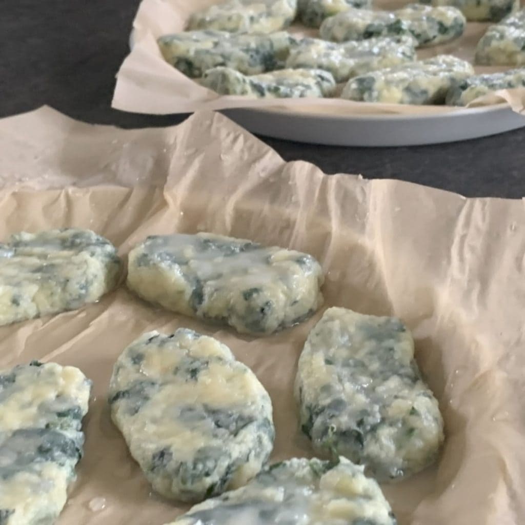 Removing and draining gnudi.