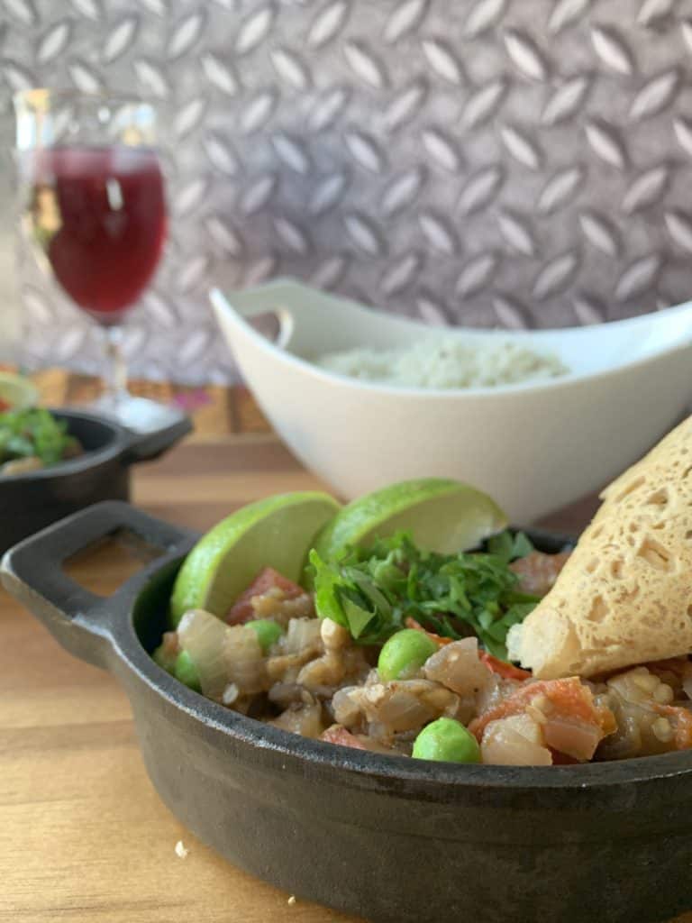 Eggplant bharta with rice and chickpea crepe.