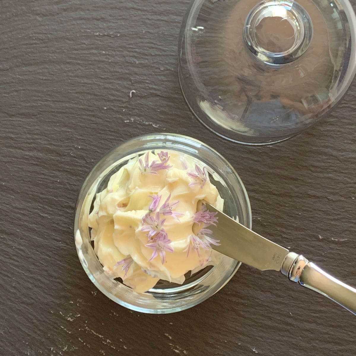 Chive butter in a butter jar.
