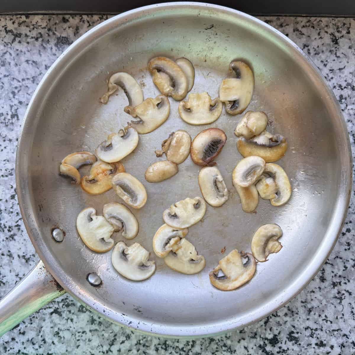 Pan with sauté mushrooms.