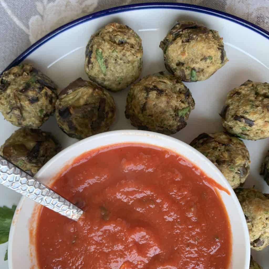 Eggplant meatballs with red sauce.