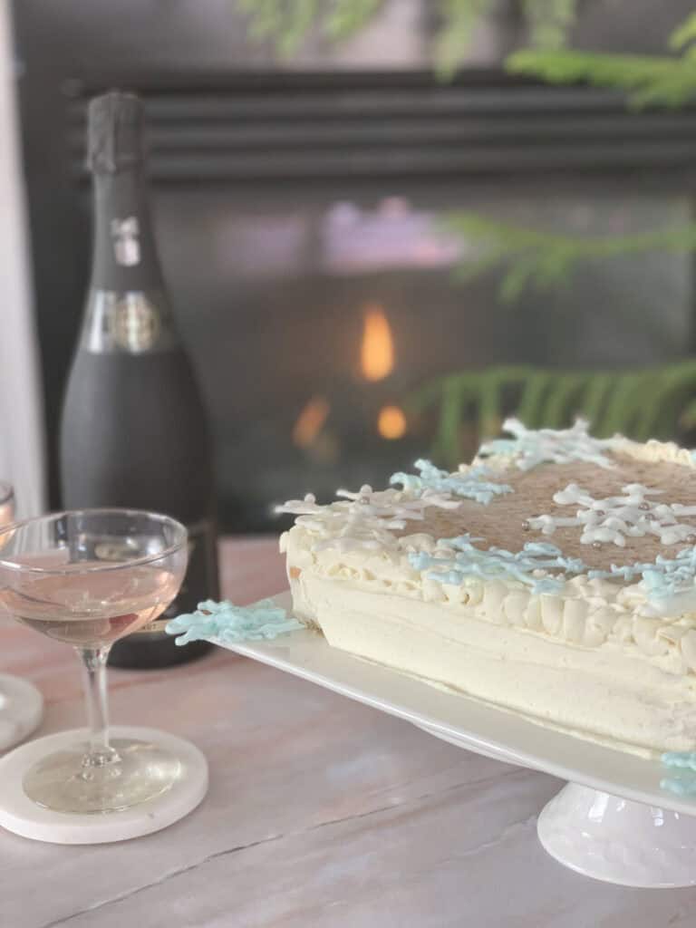 Sour cream cake and a fireplace in the background.