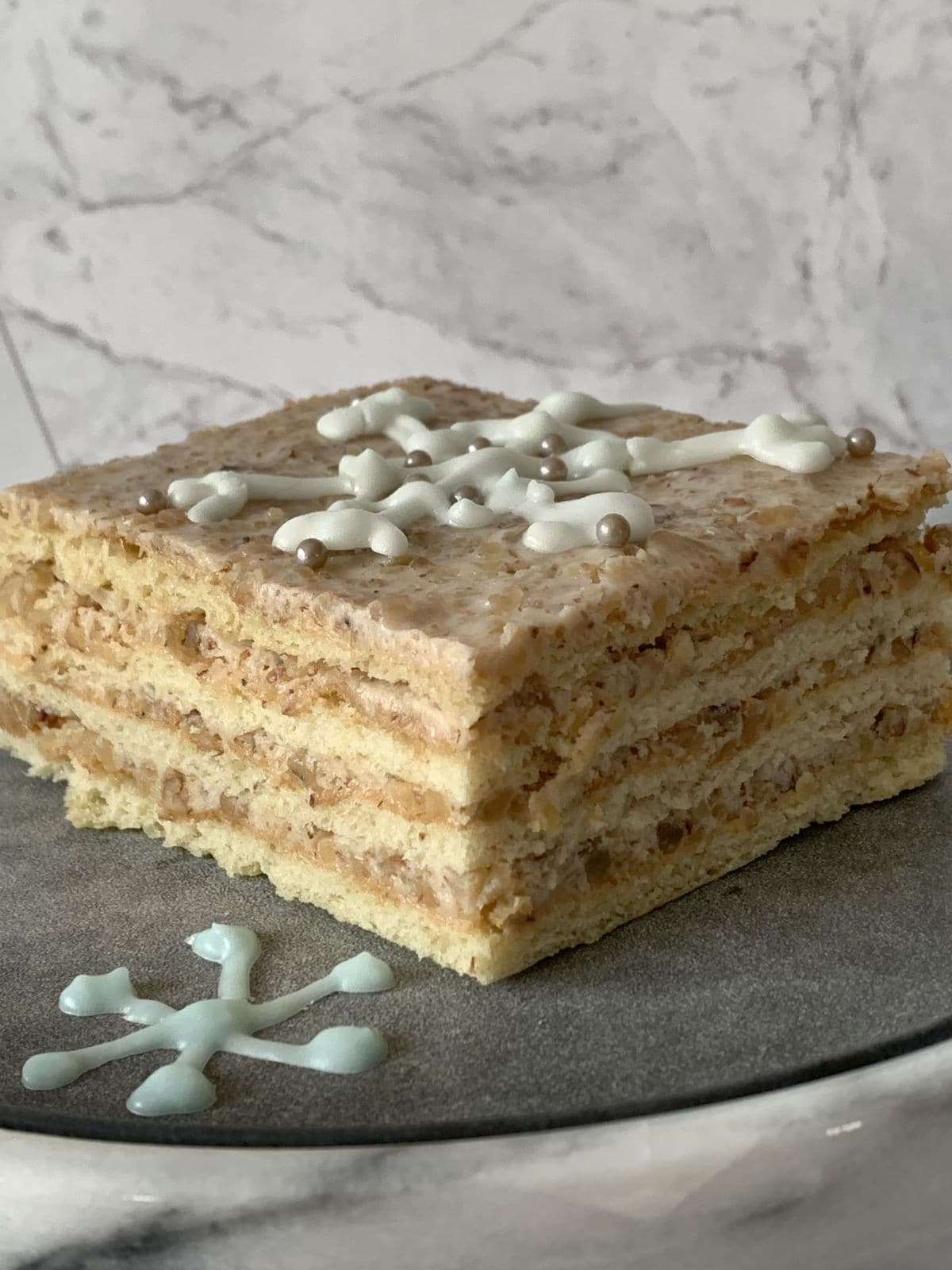 Sour cream cake on a plate.