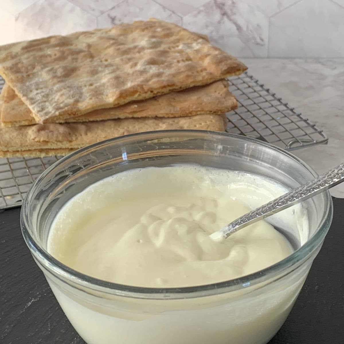 Mixing sugar and sour cream.