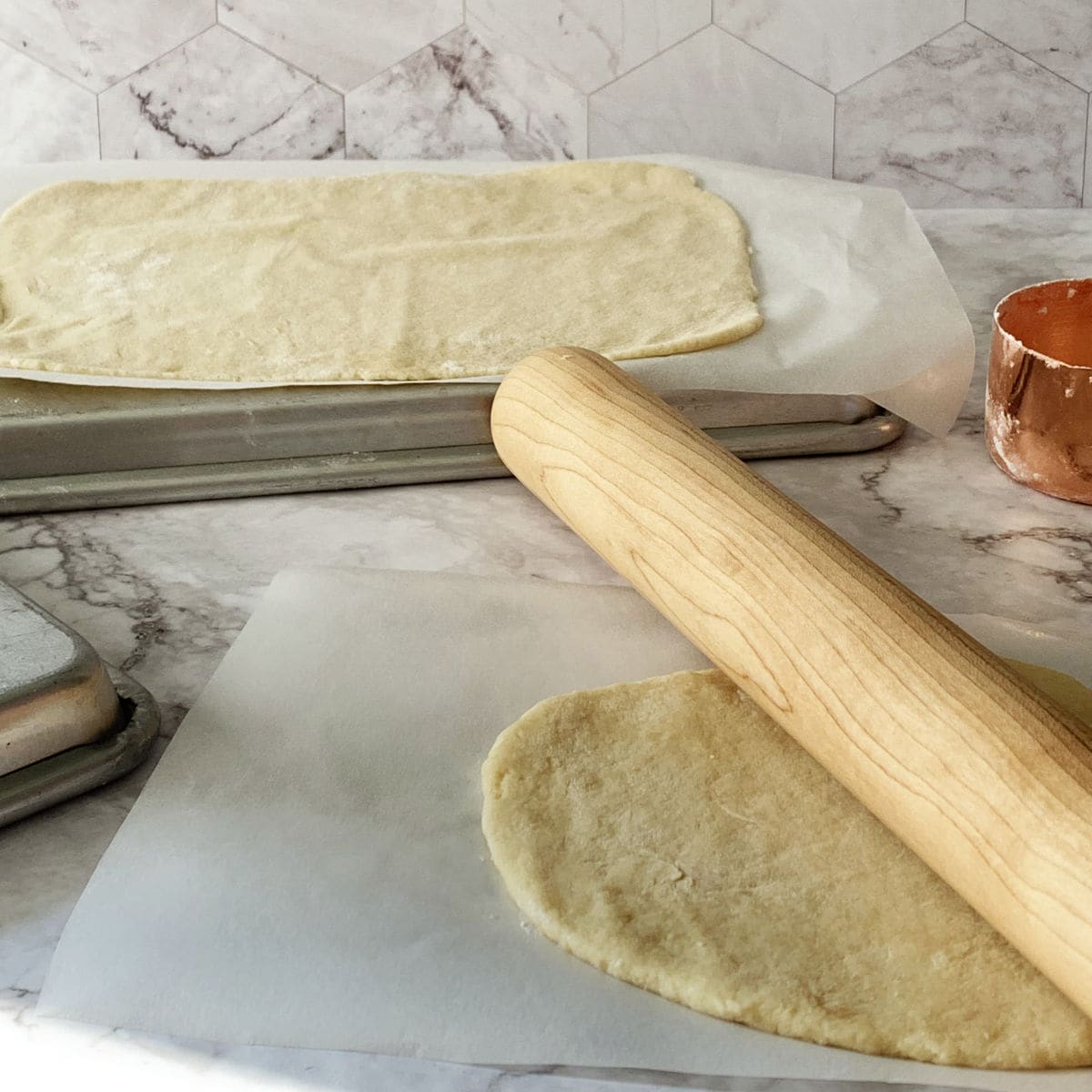 Rolling the pastry sheet for the sour cream walnut cake.
