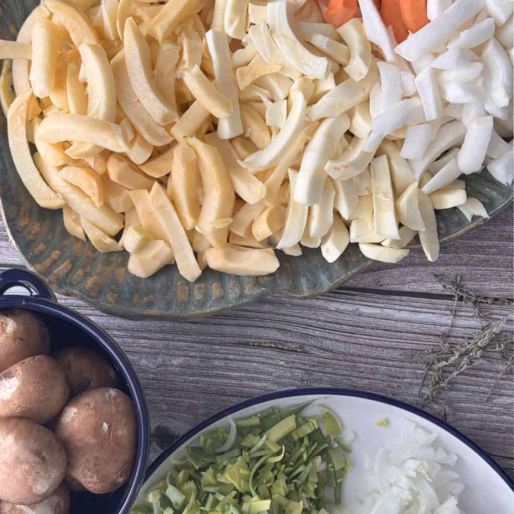 Chopped up root vegetables, mushrooms and leeks.