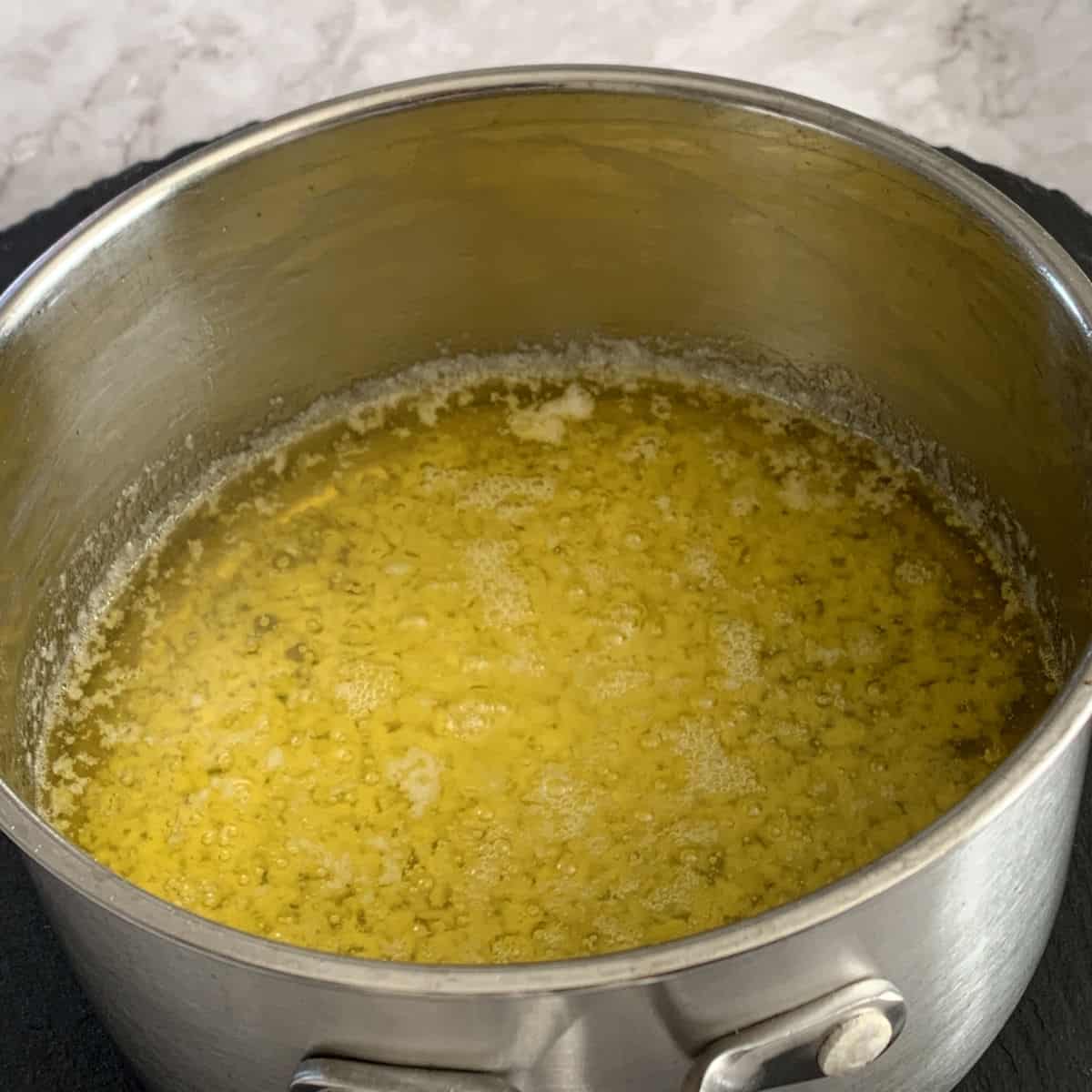Melted butter in a pot.