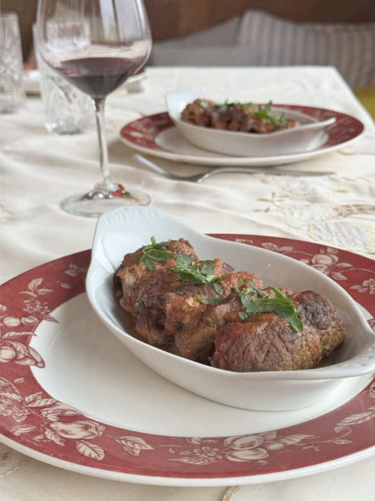 Braciole with a glass of wine.