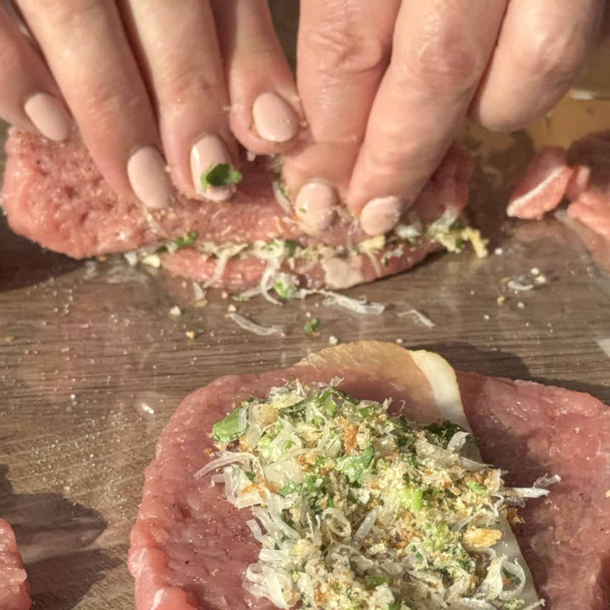 Process shots of making braciole, rolling the beef steaks.