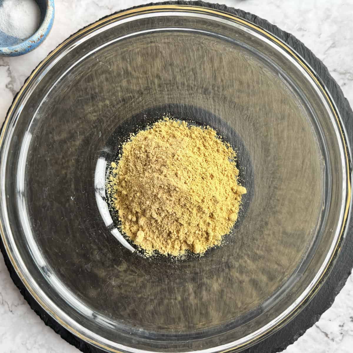 Mustard powder in a glass bowl.
