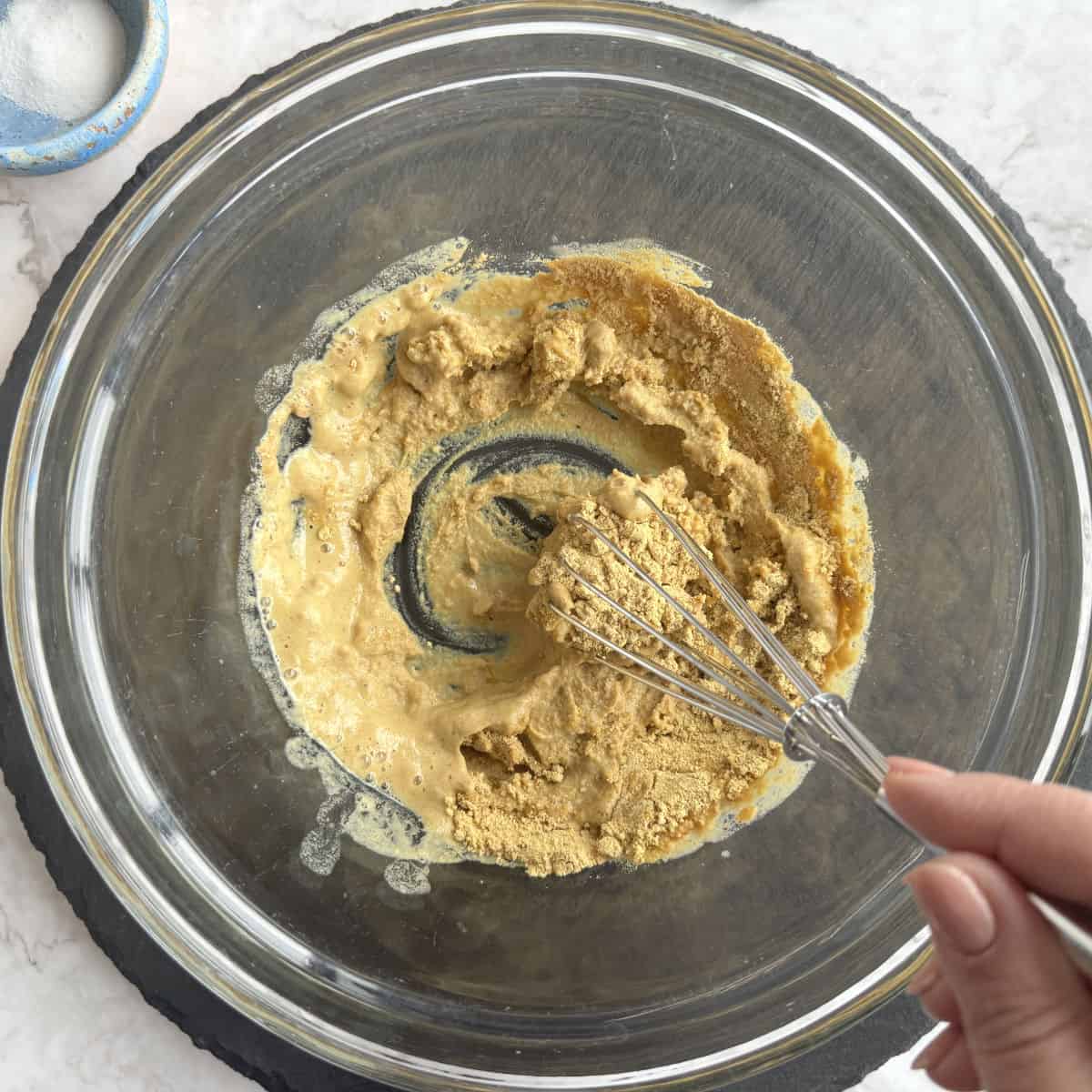 Making a paste in with mustard powder.