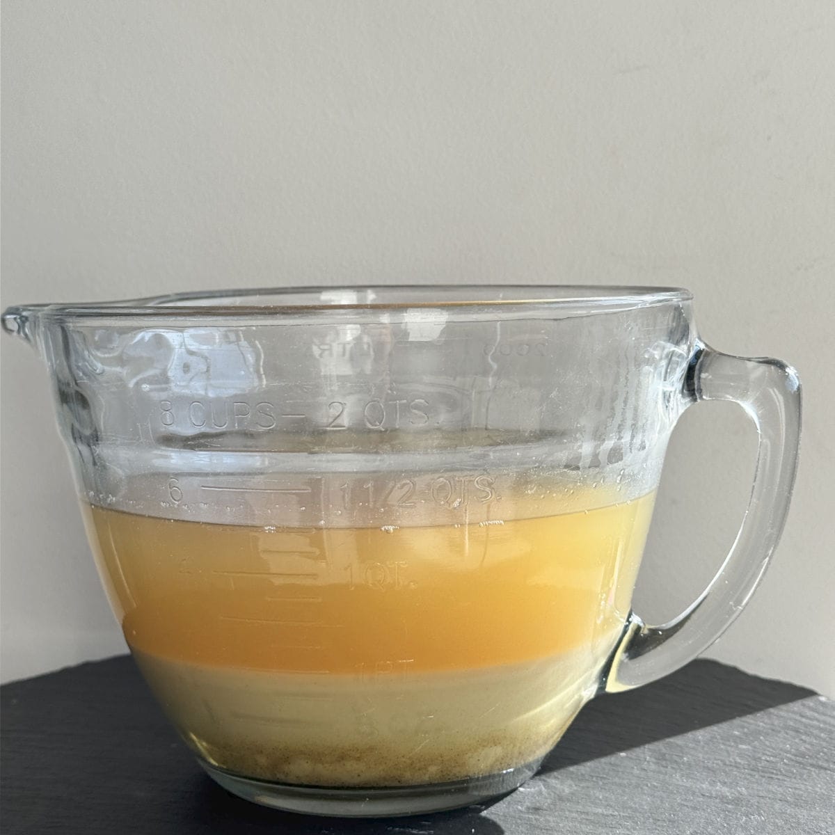 The mustard in a glass bowl.