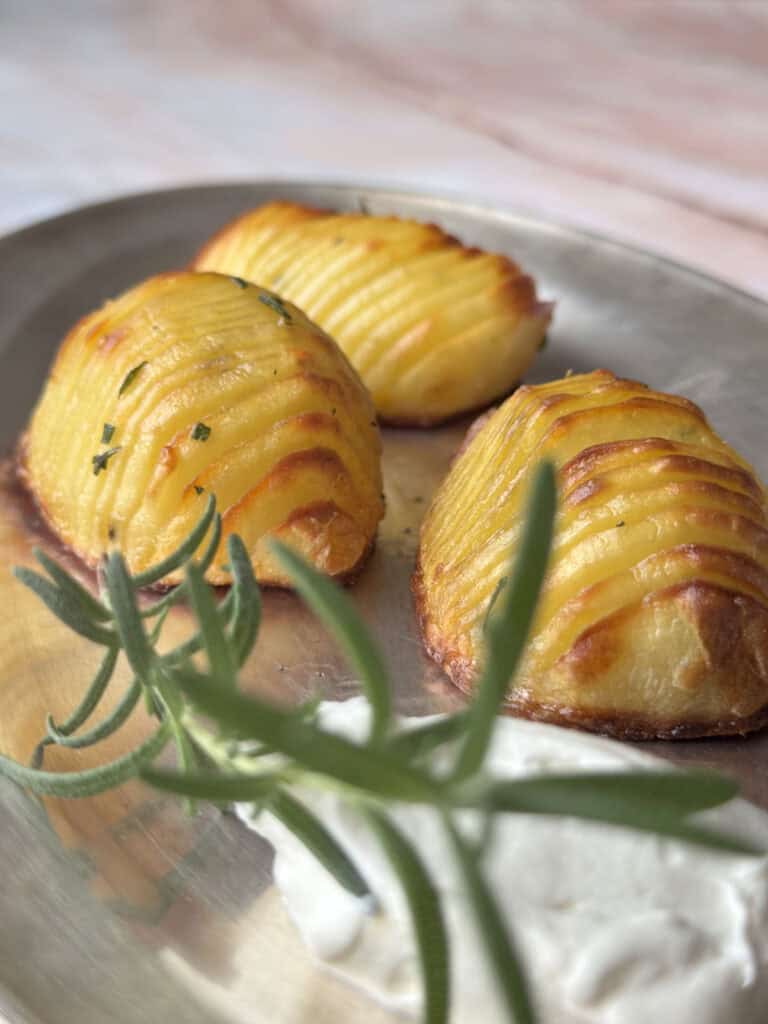 Hassleback potatoes with a dollop of sour cream.