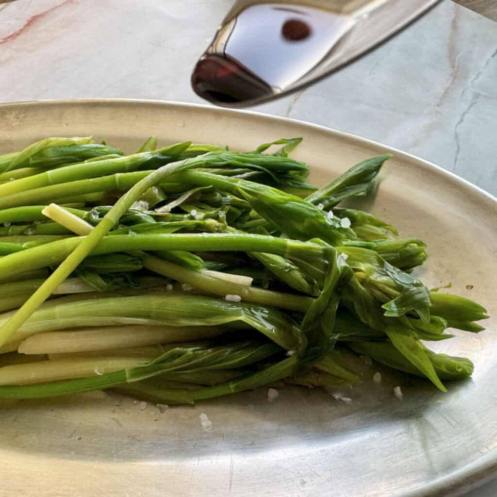 Adding drop of a vinegar to the solomon seal salad.