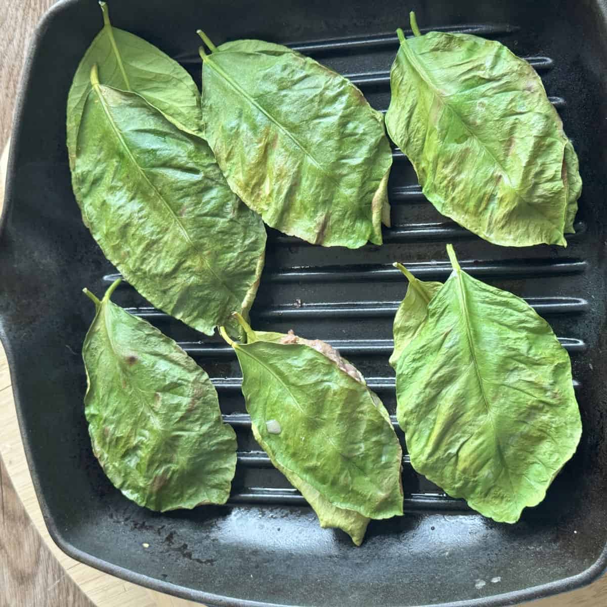 The meatball parcels are on a griddle.