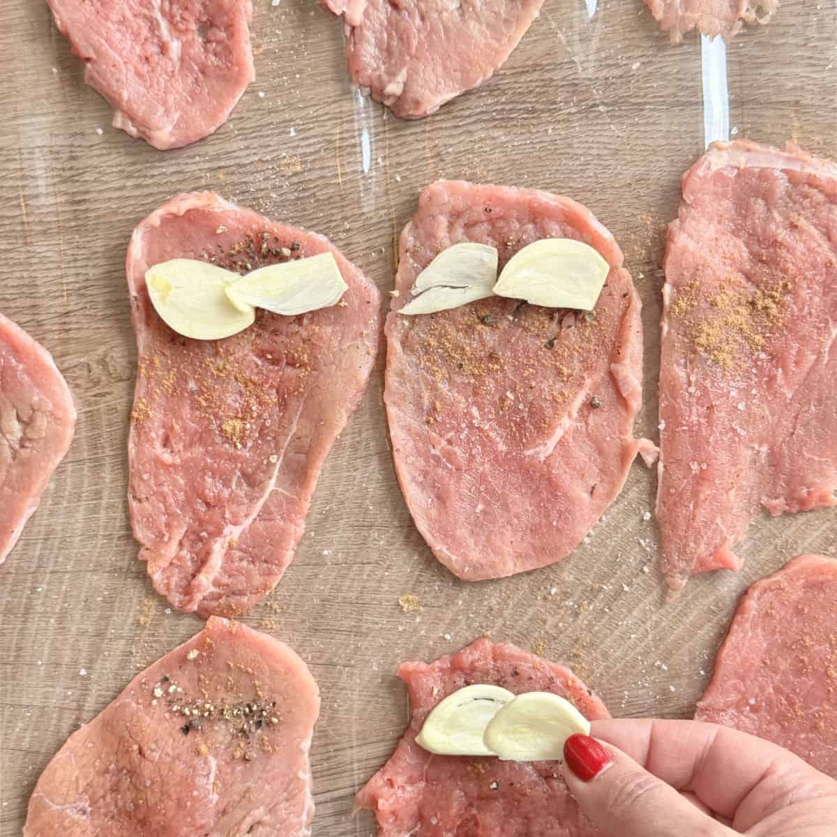 Process shots o making roasto, putting slices of garlic.
