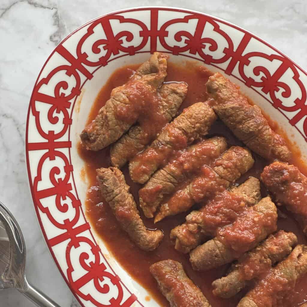 Overhead shot of the Armenian roasto rolls on a red platter.