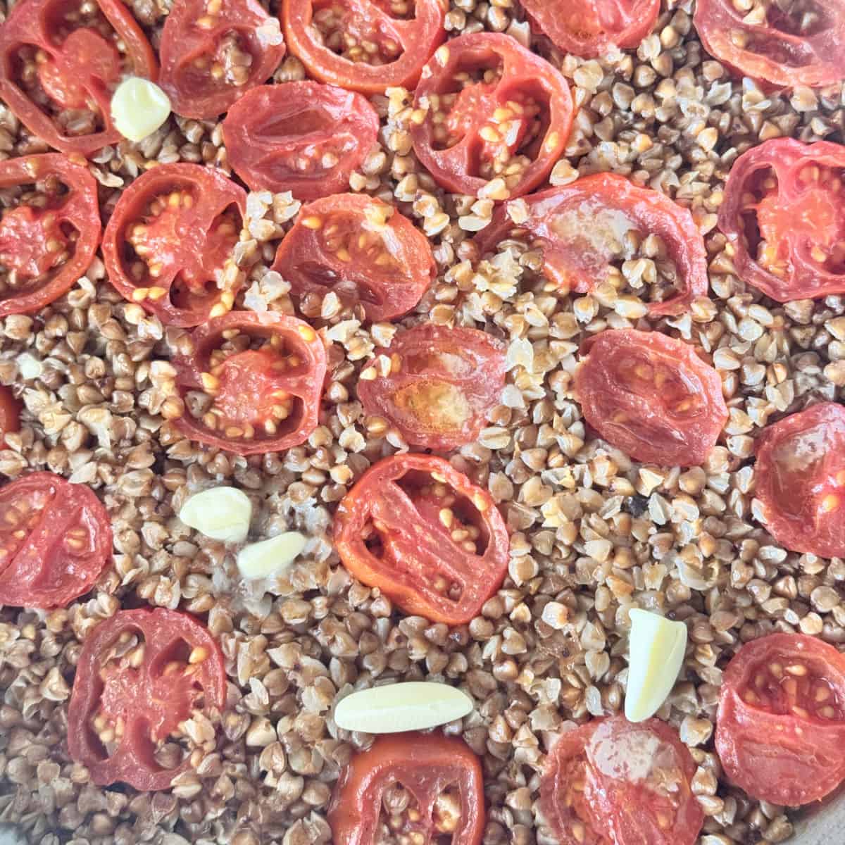 Adding dollops of butter on cooked buckwheat pilaf.