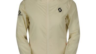 Outdoor women's windbreaker jacket with hood, lightweight and waterproof.