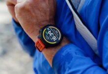 Close-up of a person wearing the Suunto Vertical 2 watch during outdoor activity.