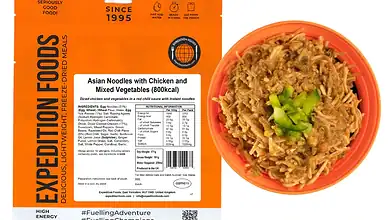 Succulent Asian noodles with chicken and vegetables in an outdoor camping meal packaging.