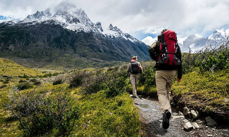 Hiking hikers with backpacks trekking in mountain landscape, alpine adventure, outdoor activity, nature exploration, outdoor insight.