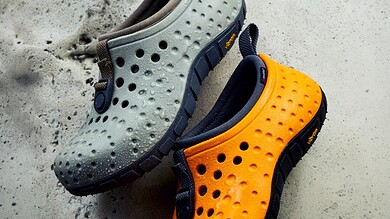 Outdoor Insight waterproof slip-on shoes in grey and orange for outdoor activities.